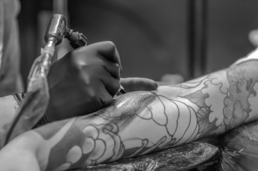 Person getting an arm tattoo